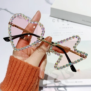 Frameless rhinestone sunglasses with heart and star-shaped pink gradient lenses