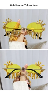 Close-up of gold rimless teardrop sunglasses with yellow lenses and flame-like rhinestones