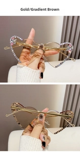 Detail of rimless heart-shaped sunglasses with gold temples and gradient brown lenses