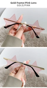 Detail of star-shaped drip rimless sunglasses with gold frame and pink lenses