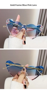 Detail of heart shaped rimless sunglasses with blue pink gradient and rhinestones