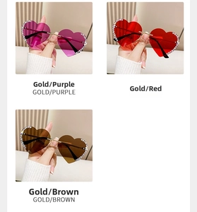 Detailansicht der randlosen herzförmigen Sonnenbrille mit Strasssteinen und goldenem Steg