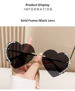 Detailansicht der herzförmigen randlosen Sonnenbrille mit Strasssteinen und Goldgestell
