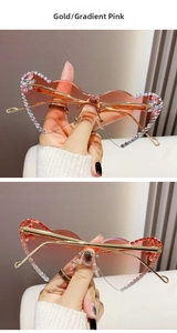Macro detail of rimless heart sunglasses with pink gradient lenses and sparkling rhinestones
