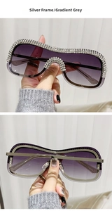 Détail de lunettes de soleil punk sans monture avec strass et monture en métal argenté