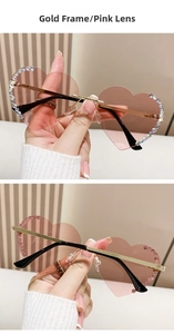 Details der randlosen Herz-Sonnenbrille mit Goldrahmen und rosa Strass-Verzierung