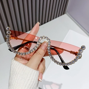 Modern semi-rimless cat-eye sunglasses with pink gradient lenses and crystal rhinestones