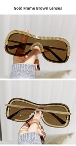 Détails des lunettes de soleil à monture dorée avec strass et verres marrons