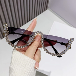 Modern half-frame sunglasses with purple gradient lenses and diamond-encrusted wave edges