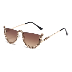 Modern gold semi-rimless sunglasses with brown gradient lenses and rhinestone accents