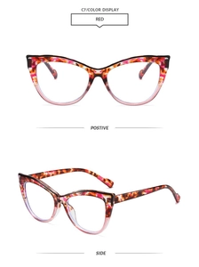 Detail view of cat eye glasses frame with red tortoiseshell top and pink gradient bottom