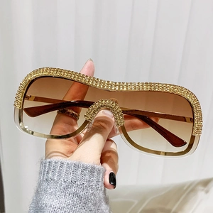 Lunettes de soleil de luxe sans monture avec cadre doré et strass étincelants