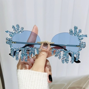 Frameless tear-shaped sunglasses with blue rhinestones and gold metal frame for parties