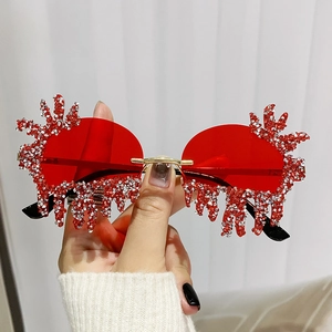 Frameless teardrop shaped sunglasses with red rhinestones for party and festival fashion