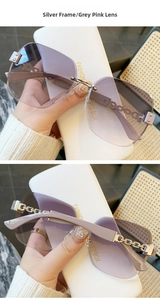 Dettaglio di occhiali da sole senza montatura argento con lenti sfumate grigio e rosa