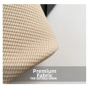 Gros plan sur la matière tressée haut de gamme avec textures beige et kaki du sac seau