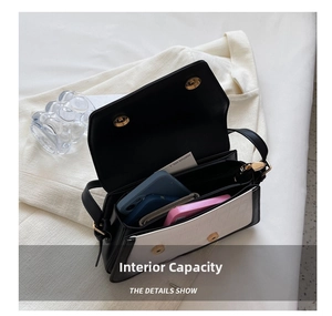 Top view of two-tone shoulder bag interior showing spacious compartments and croc pattern