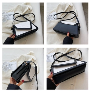 Detail showing contrast colors and crocodile texture on this chic crossbody bag