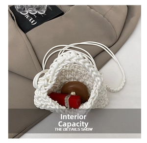 Detail view of woven mini bag interior showing capacity for lipstick and compact powder