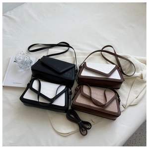 Detailed flat lay of crocodile pattern crossbody bags in four elegant colors