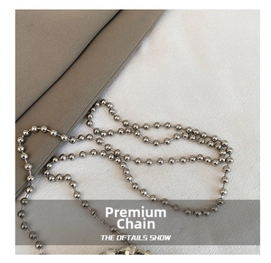 Close-up of high-quality polished silver metal bead chain for luxury handbags