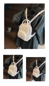 Close-up of beige pleated mini backpack with metallic zipper detail and mesh side panel
