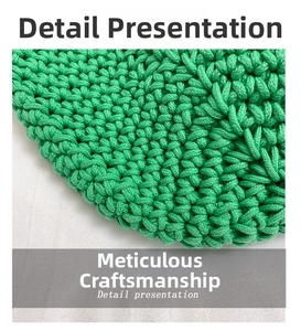 Macro shot of green handmade crochet fabric showing dense woven texture and craftsmanship