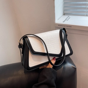 Fashionable black and white contrast underarm bag with crocodile pattern and V-shaped flap
