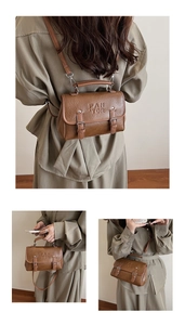 Brown vintage faux leather crossbody bag showing dual buckle detail and adjustable strap