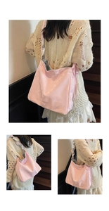 Detail of pink satin tote bag with cloud texture, silver lining and drawstring strap