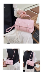 Detail of pink faux leather handbag with PANTOR logo and decorative buckles