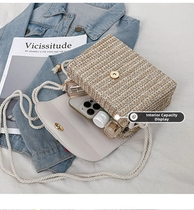 Internal capacity of straw woven bag showing space for phone and perfume accessories