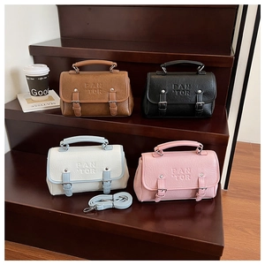 Group of four small retro PU leather handbags in brown, black, white and pink colors