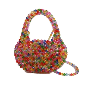 Colorful handmade beaded crossbody bag with vibrant spherical beads and woven top handle