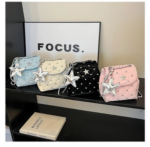Quilted mini backpacks in shiny patent leather featuring silver star charms and studs