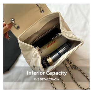 Internal capacity view of quilted crossbody bag showing storage space for cosmetics