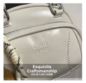Detailed close-up of white leather handbag texture with CHIC '2ND logo and silver zipper