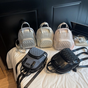Minimalist matelassé mini backpacks in five stylish colors with adjustable straps