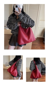 Detailansicht der großen roten Shopper-Tasche aus weichem Leder mit breitem Schultergurt