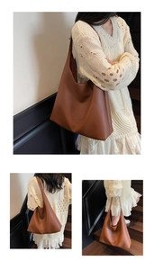 Detailaufnahme der braunen Kunstleder-Tasche mit Lychee-Narbung und weichem Tragegriff
