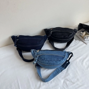 Three denim waist bags in dark blue, black, and light blue shown on a clean white surface