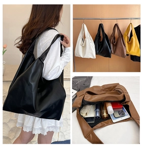 Detail view of a spacious leather hobo tote bag showcasing multiple colors and interior capacity