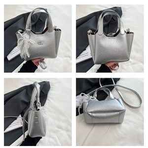 Detailed four-view of silver bucket bag with embossed leather and pearl lace charm