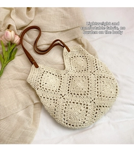 Detailed close-up of ivory crochet weave and brown leather strap with rivets