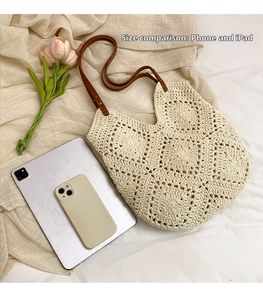 Size comparison showing crochet sunflower tote bag holding an iPad and a smartphone