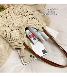 Spacious beige sunflower knit tote bag showing interior storage capacity for daily essentials