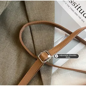 Detail of adjustable leather strap with silver metal buckle and premium stitching