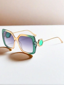 Detail of metal temple with green gem decoration and gradient square frame sunglasses