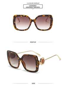 Detail of leopard print square frame sunglasses with golden honeycomb hinge decoration