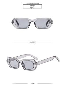 Detail view of gray square frame sunglasses with metal hinge accents and sleek lenses